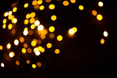 Parlak altın parıltılı şenlik arka planı. Soyut parıldayan daireler dekoratif arka plan. Parlak efektli Bokeh ışıkları. Üst üste parlayan ve parıldayan noktalar