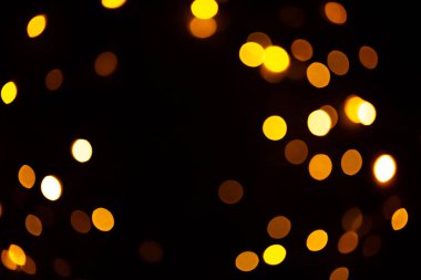 Parlak altın parıltılı şenlik arka planı. Soyut parıldayan daireler dekoratif arka plan. Parlak efektli Bokeh ışıkları. Üst üste parlayan ve parıldayan noktalar