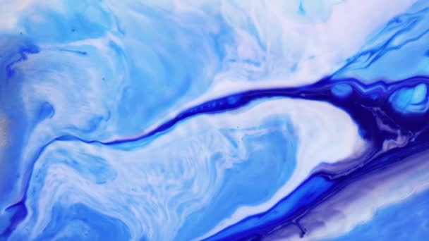 Peinture d'art fluide au ralenti. Texture abstraite. Conception de formes de fond liquide. Fond psychédélique avec des peintures colorées dans des motifs abstraits. Peinture créative bleue et blanche .