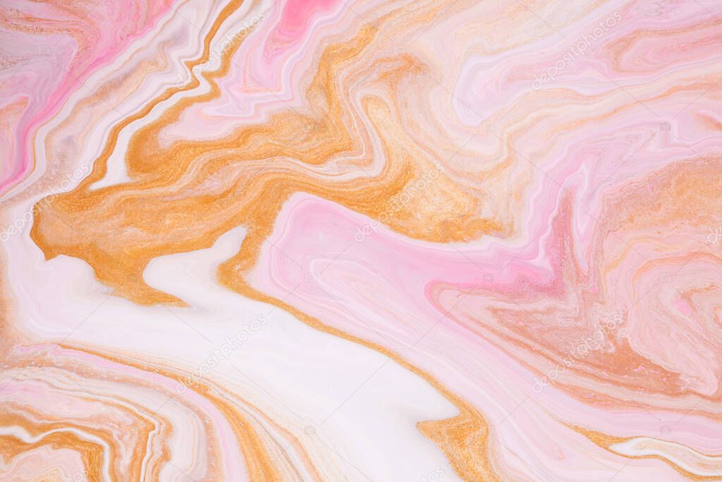 Fluid art texture. Abstract backdrop with iridescent paint effect. Liquid acrylic artwork with colorful mixed paints. Can be used for background or poster. Golden, pink and white overflowing colors.