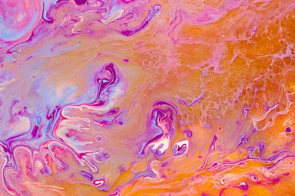Fluid art texture. Abstract backdrop with mixing paint effect. Liquid acrylic picture with trendy mixed paints. Can be used for website background. Purple, golden, orange and blue overflowing colors.