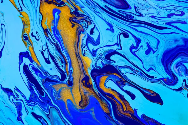 Fluid art texture. Backdrop with abstract iridescent paint effect. Liquid acrylic artwork with chaotic mixed paints. Can be used for posters or wallpapers. Blue, golden and cyan overflowing colors.