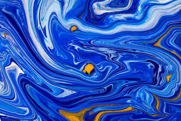 Fluid art texture. Abstract background with swirling paint effect. Liquid acrylic artwork with beautiful mixed paints. Can be used for interior poster. Blue, golden and white overflowing colors.