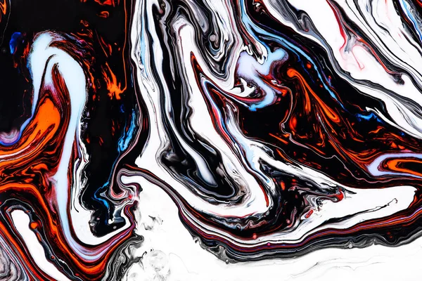 Fluid art texture. Background with abstract iridescent paint effect. Liquid acrylic picture that flows and splashes. Mixed paints for posters or wallpapers. Orange, black and blue overflowing colors.