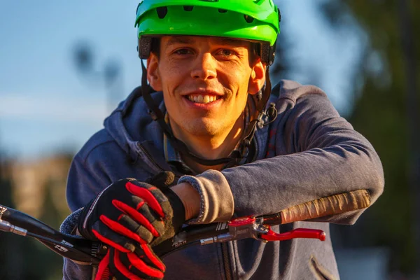 Young rider making tricks on bicycle on the street