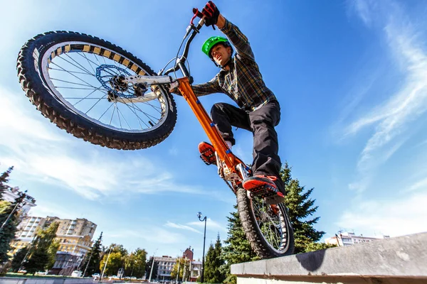 professional bmx rider training on the street