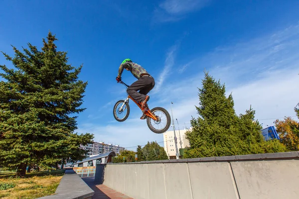 rider making tricks on bmx bicycle on the street