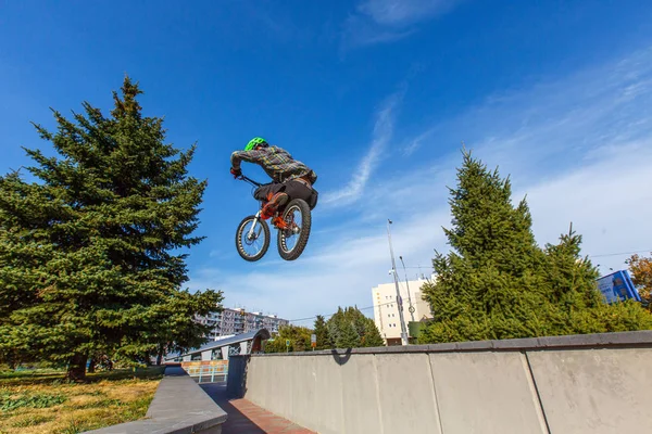 rider making tricks on bmx bicycle on the street