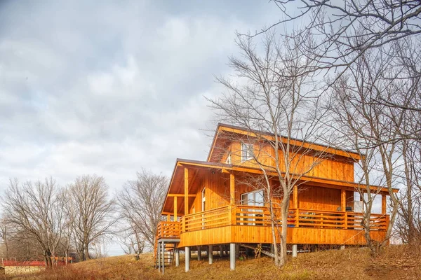 Contemporary wooden single family cottage on lake