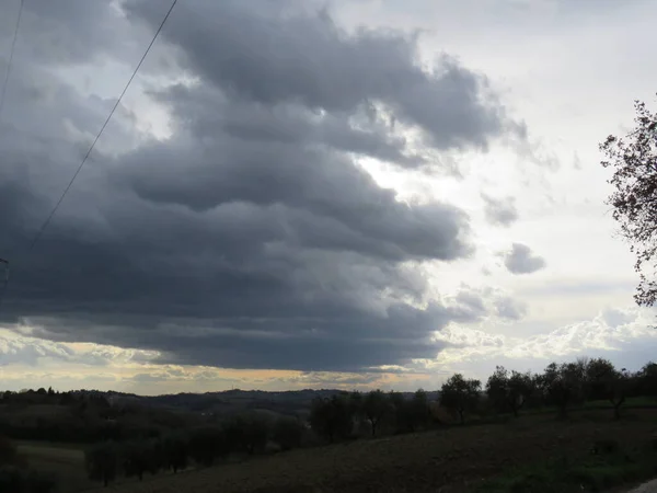 Cloudy landscape, the clouds with the help of the wind often change their shapes always changing the view of a landscape