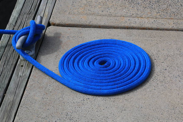 Coiled rope on boat dock