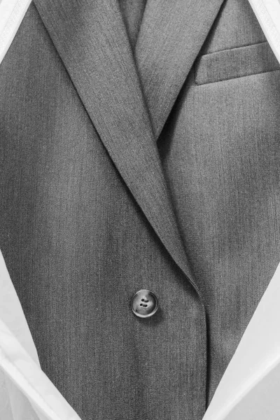 Business blue male suit in a white case with a zipper. — Stock Photo, Image