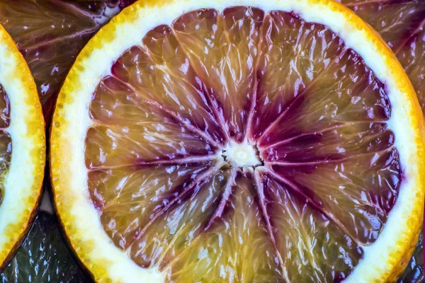 Round slices of red orange, background and texture — Stock Photo, Image