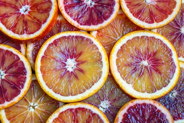 Round slices of red orange, background and texture — Stock Photo, Image