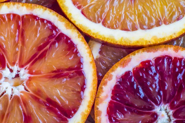 Round slices of red orange, background and texture — Stock Photo, Image