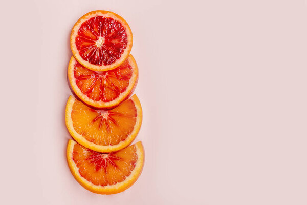 round slices of red orange, background and texture