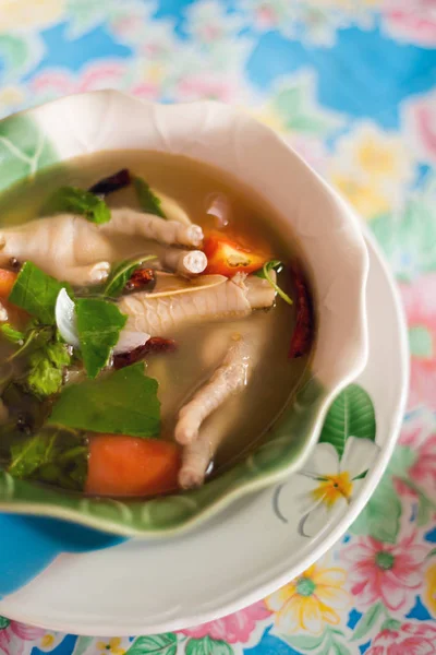 Herb chicken leg spicy soup — Stock Photo, Image