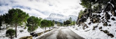 Winter scene in Grazalema, Cadiz. The road that goes down from Puerto de las Palomas remains closed due to snowfall. clipart