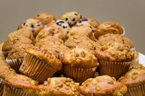 Plate of fresh blueberry and nut muffins — Stock Photo, Image