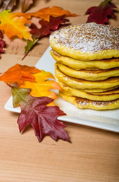 Fresh pancakes with fall leaves — Stock Photo, Image