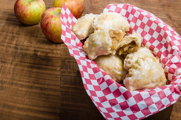 Baked apple fritters in a basket