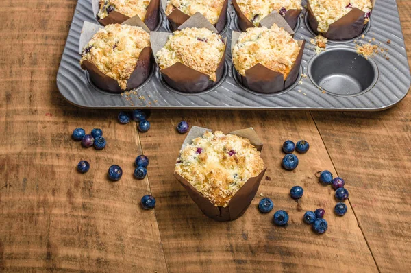 Fresh baked blueberry muffins on table — Stock Photo, Image