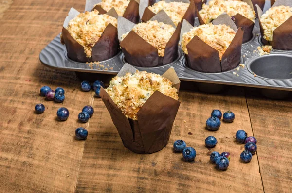 Fresh baked blueberry muffins on table — Stock Photo, Image