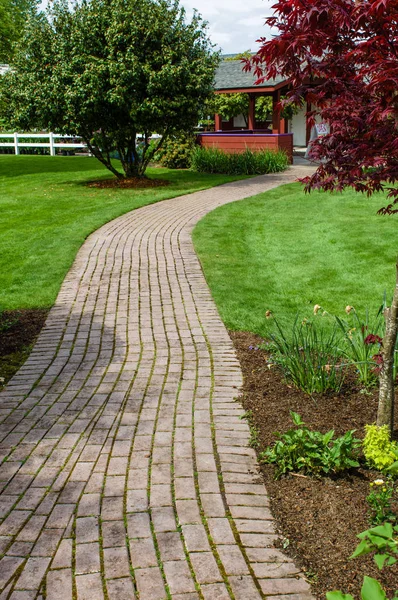 Brick pathway in a park — Stock Photo, Image