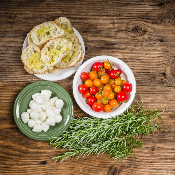 Bread tomatoes and cheese ingredients — Stock Photo, Image