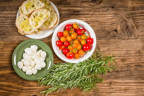 Bread tomatoes and cheese ingredients — Stock Photo, Image