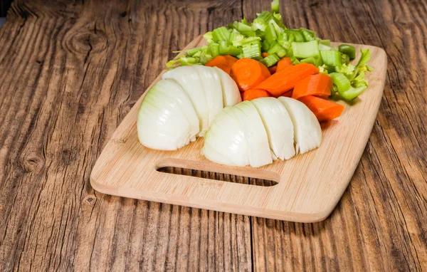 Vegetable mirepoix on a cutting board — Stock Photo, Image