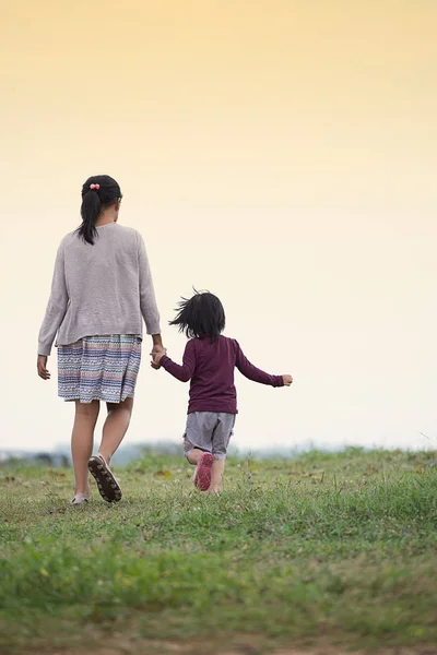 Young Sister Walking Green Grass Evening Time — Stock Photo, Image