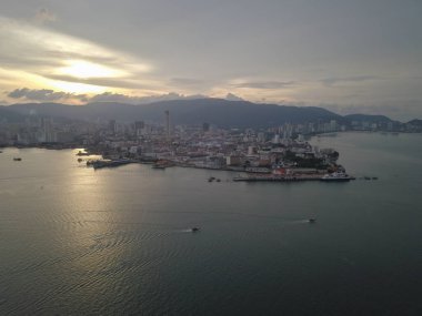 Aerial view two boats move at the sea of Penang island. clipart