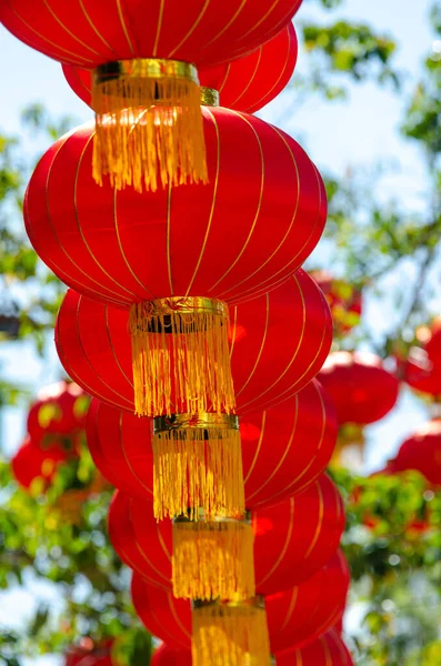Row of red lantern with green background.