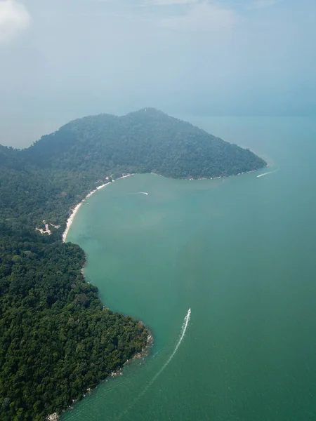 Vertical view boat move at Monkey Beach, Penang National Park.