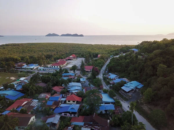 Aerial view Malays village near the mangrove forest.