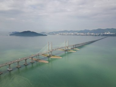 Aerial view Penang Bridge with island at background. clipart