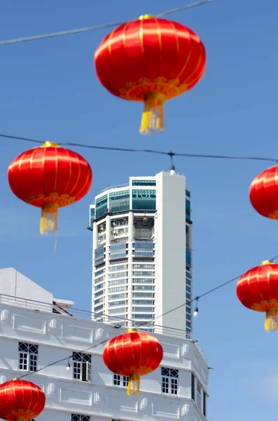 Red lantern at heritage town. Background is KOMTAR building. — Stock Photo, Image