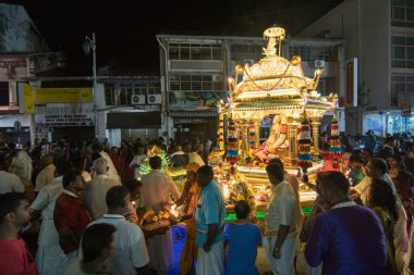 Gold chariot arrive little India with worshipper during Thaipusam.