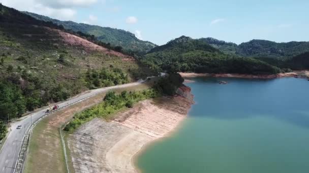 Aerial view the road beside Dam. — Stock Video