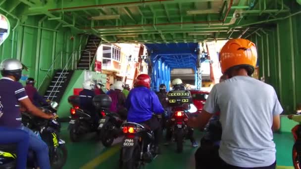 Motorcyclist on the way leaving the ferry into terminal. — Stock Video