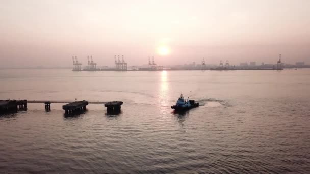 Aerial view tug boat in early sunrise morning. — Stock Video