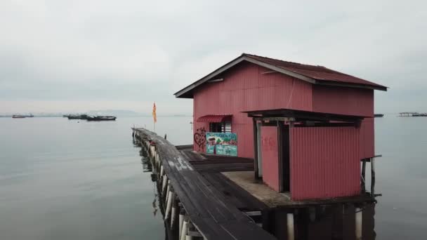 Tracking red wooden house temple at wooden bridge. — Stock Video