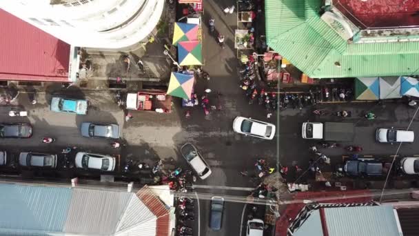 Aerial busy traffic jam at crossroads near pasar pagi. — Stock Video