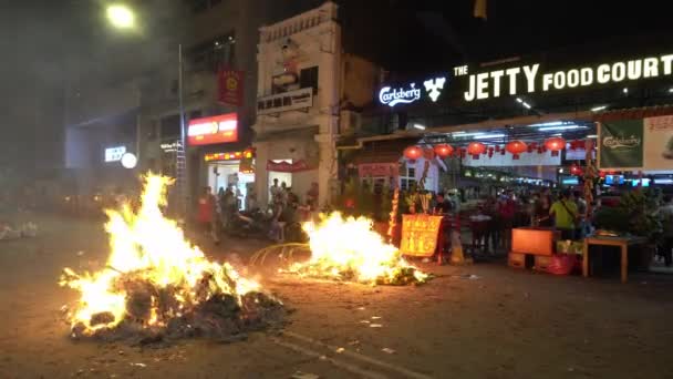 Burning of joss paper in front of The Jetty food court — Stock Video