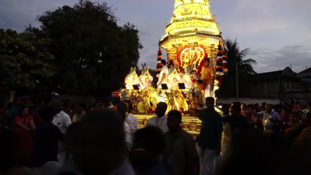 Golden chariot pulled by devotees during street procession — Stock Video