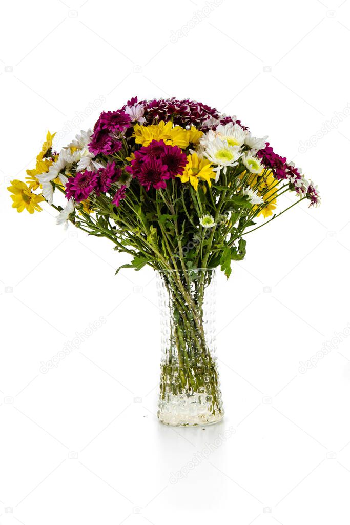 Flower arrangement in a glass vaze isolated on a white background