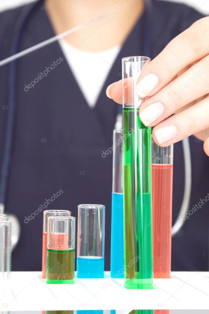 researcher working with tubes at the laboratory