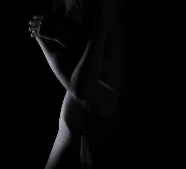 Woman posing in black shadow — Stock Photo, Image