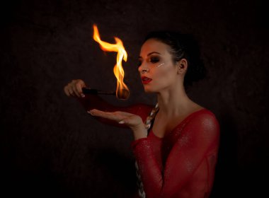 juggler girl performing fire games with python snake dress clipart